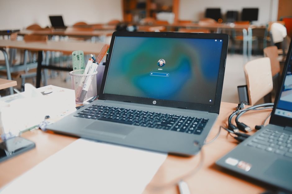 Computer science students working on laptops